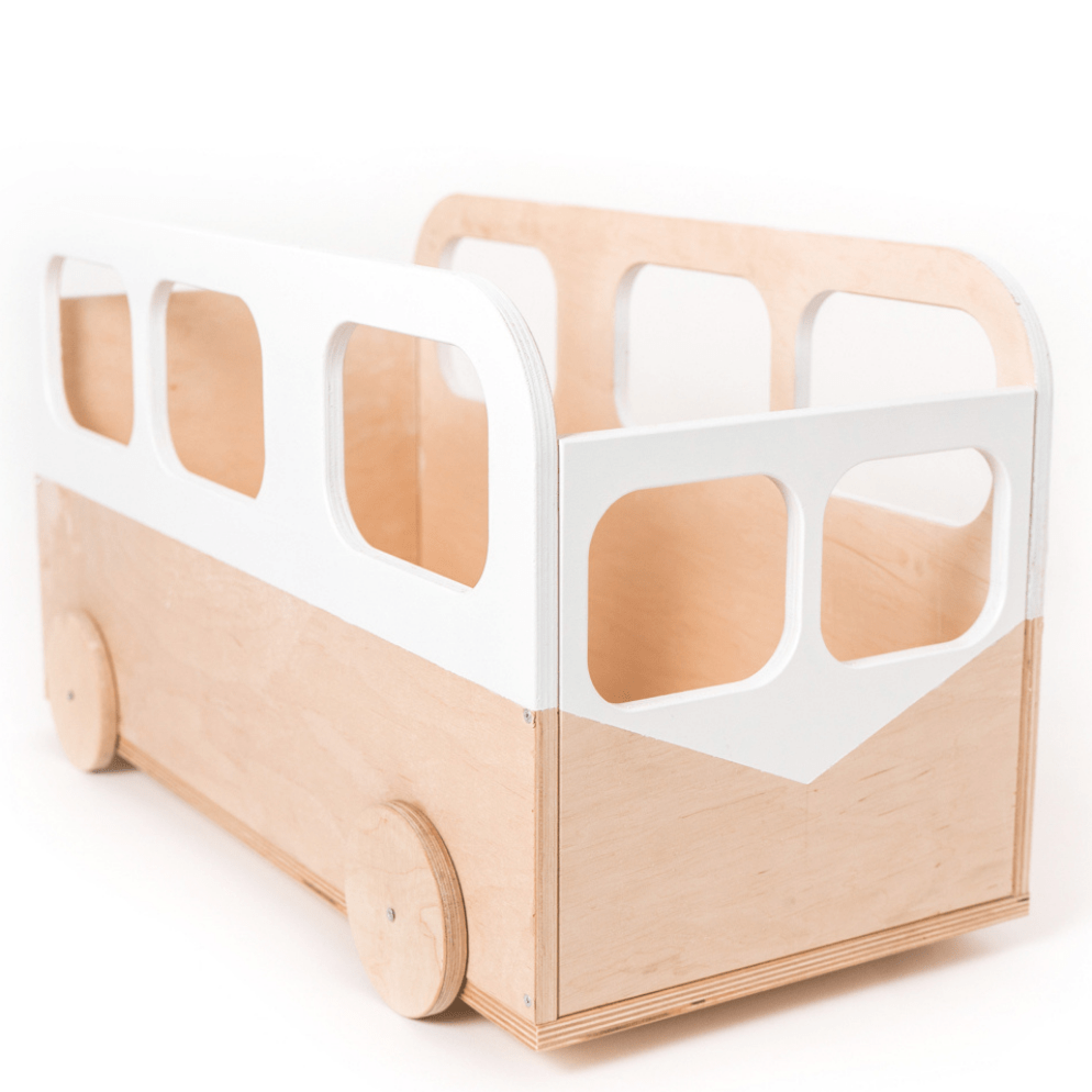 A wooden toy bus with a minimalist design, featuring round wheels and white cutout windows on its sides. The bus has an open top and smooth edges, suitable for children's play or storage.